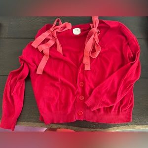 Red off the shoulder tie sweater